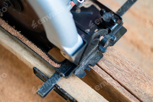 Preview: Circular saw cutting through wooden plank