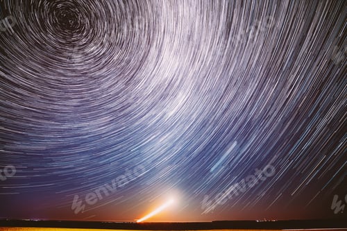 Preview: Moonrise Sky Natural Background. Unusual Amazing Stars Effect In Sky. Trace Of Moon. Spin Of Star
