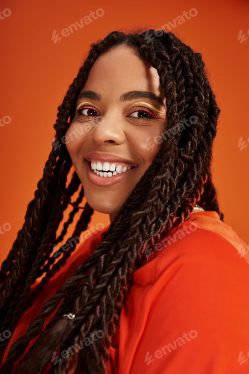 Preview: Bright and joyful portrait of an African American woman with stylish braids