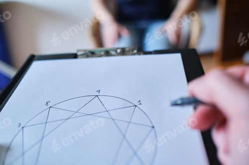 Preview: Closeup shot of a therapist taking notes during a therapy session