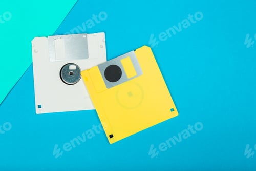 Preview: Floppy disks on a blue background showing retro technology and data storage methods