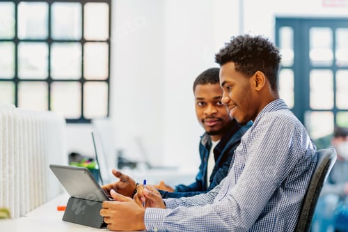 Preview: two black men work together