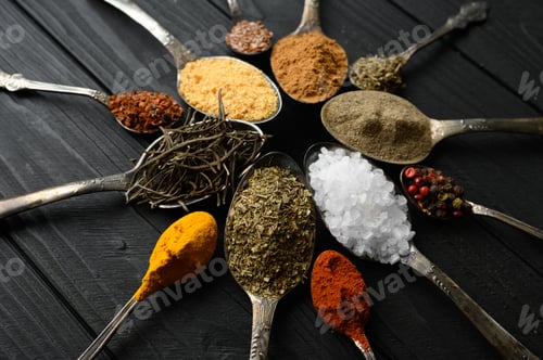 Preview: Colorful various herbs and spices for cooking on dark wooden rustic background