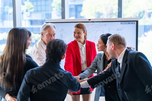 Preview: Diverse business team celebrates success with a celebratory huddle and high-fives in modern office