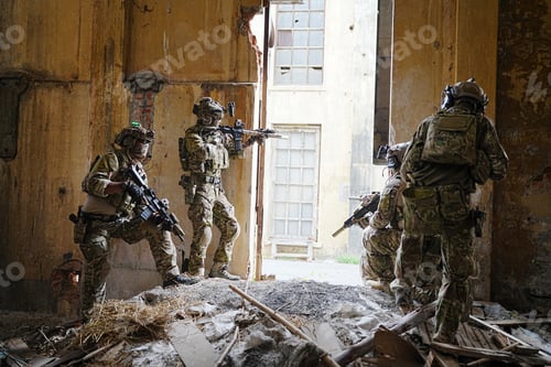 Preview: Soldier in full US MARSOC armed with assault rifle run through the abandoned building. Military