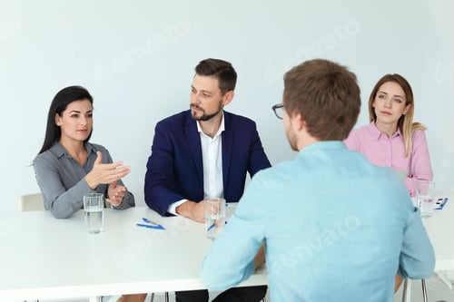 Preview: Human resources commission conducting job interview with applicant in office