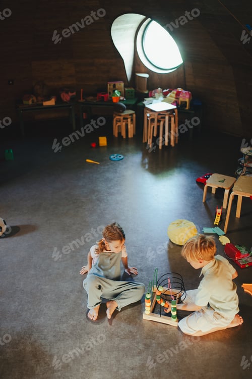 Preview: Children are playing together in indoor play area at a restaurant.