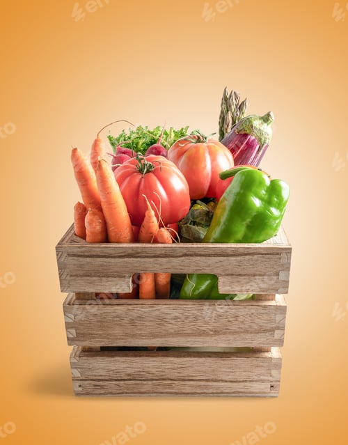 Preview: Wooden crate overflowing with fresh garden vegetables on orange background
