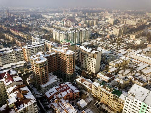 Preview: Aerial black and white winter top view of modern city center with tall buildings