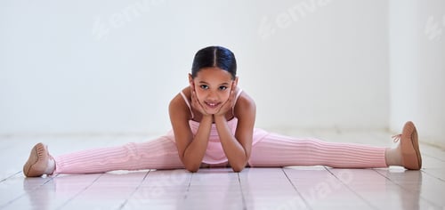 Preview: Can you do the splits like this. Portrait of a little girl doing the splits in a ballet studio.