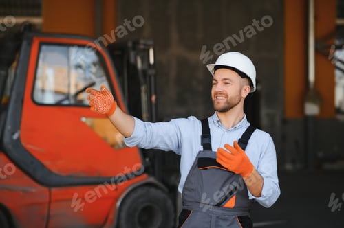 Preview: Portrait of warehouse forklift driver standing in storehouse by the machine.