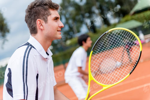 Preview: Men Playing Doubles At Tennis And Looking Happy