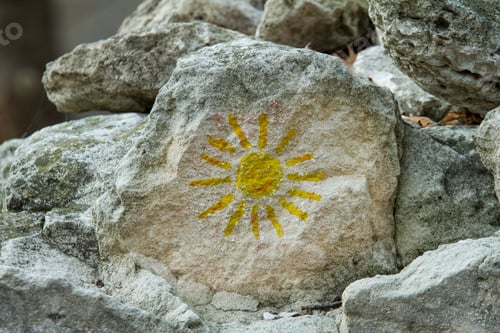 Preview: Mountain rocks with design sun.