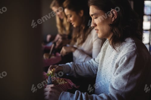 Preview: Friends having burger together