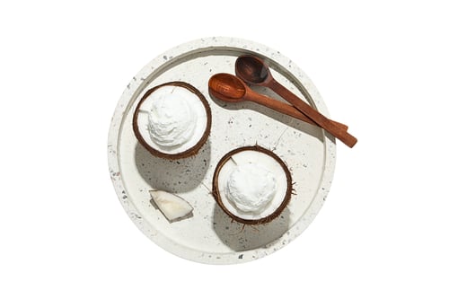 Preview: Coconut dessert in bowls with wooden spoons, on white background