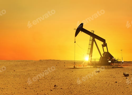 Preview: Pumpjack rig pumps oil in the desert at sunset. Dead land and sand, concept