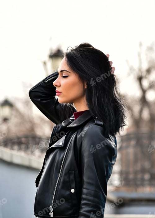 Preview: A young beautiful girl walks down the street. City. Atmosphere.