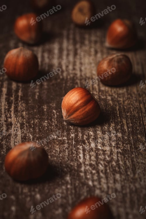 Preview: close up view of shelled hazelnuts on wooden tabletop