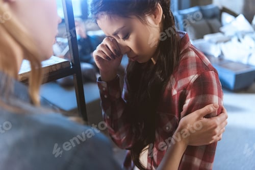 Preview: Young woman supporting her girlfriend in depression