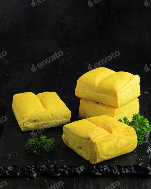 Preview: Yellow Soft Tofu and wooden Table Background.