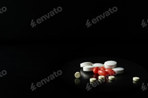 Preview: Group of different medical pills on black background