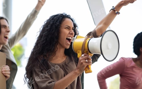 Preview: Closeup of motivated woman leading group of strikers