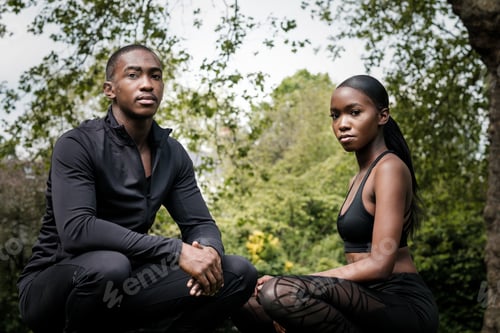Preview: Black brother and sister twins posing outdoor in stylish sportswear.