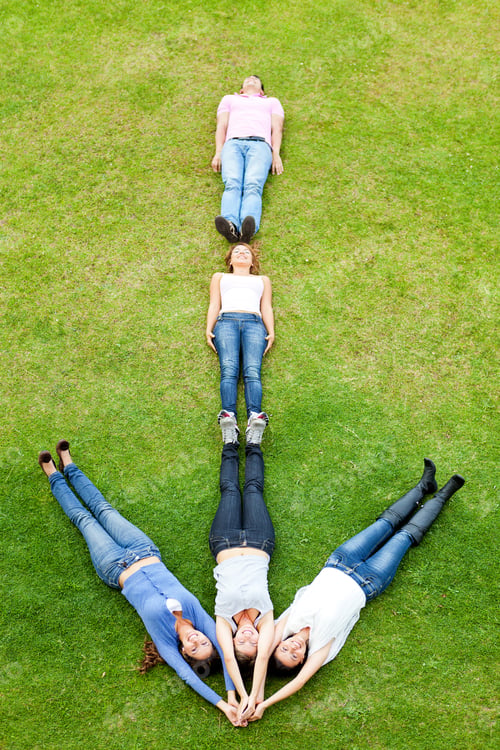 Preview: Group Of People Lying Down Making An Arrow - Outdoors