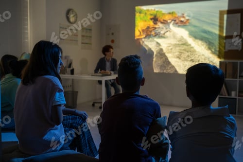 Preview: Group of schoolkids watching video about natural environment