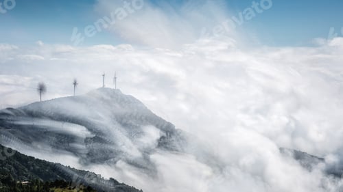 Preview: mountain top of wind farms with clouds
