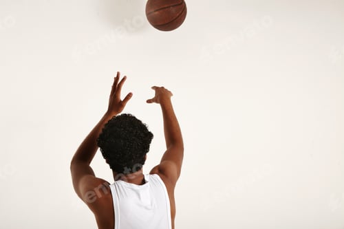 Preview: Handsome young African American throwing a vintage basketball