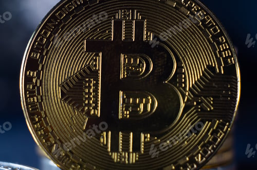 Vista previa: Coin with the Bitcoin on it on a blurred background