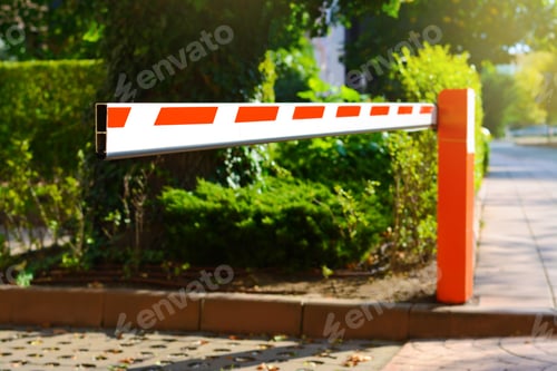 Preview: Closed boom barrier on sunny day outdoors