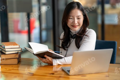 Preview: Education study abroad, Asian student girl look at laptop while doing homework making video call abr