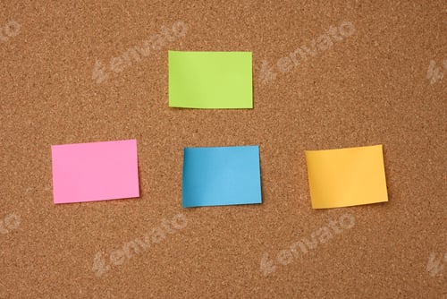 Preview: Multicolored square sticks are glued to the brown cork texture