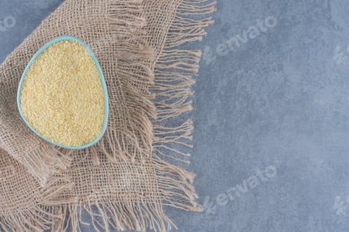 Preview: A bowl of rice on the towel, on the marble background