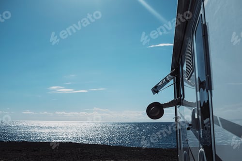 Preview: Overjoyed tourist people arrive at destination with camper van vehicle parking on che ocean