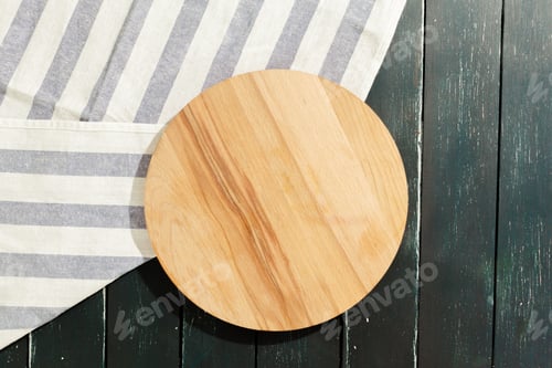 Preview: empty wooden board with tablecloth on dark desk