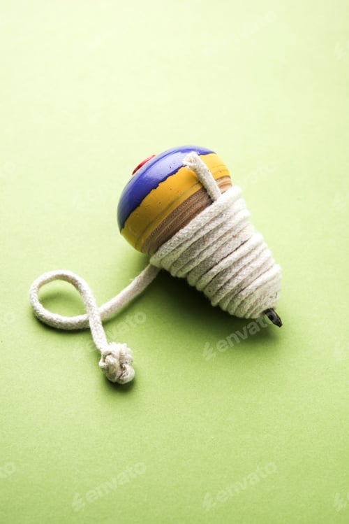 Colorful Spinning Top on a Green Background