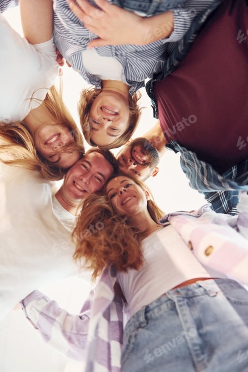 Preview: Looking down. Group of friends standing together