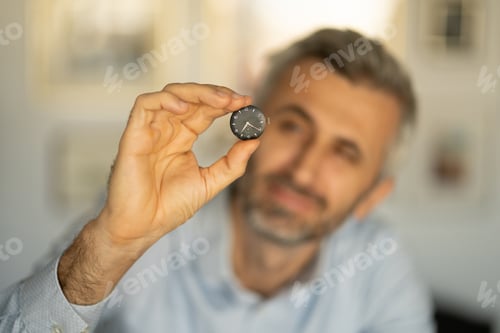 Preview: Portrait closeup of a professional watchmaker