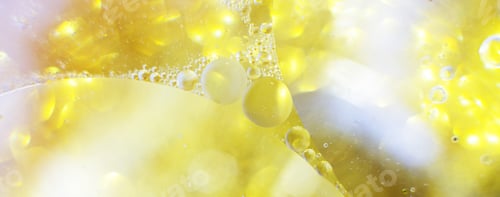 Preview: Gold Oil bubbles close up. circles of water macro. abstract shiny yellow background. banner