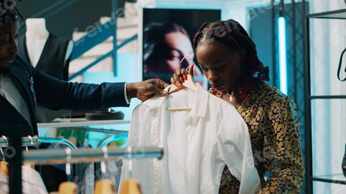 Preview: African american shopper looking for pregnancy clothing items