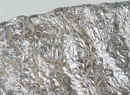 Preview: Crinkled silver aluminum foil texture with light reflections and wrinkled