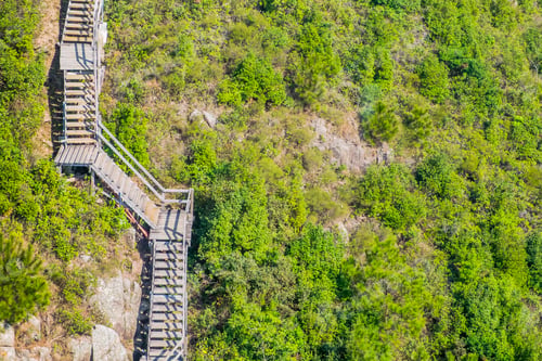 Preview: aerial view of wooden stairs claim to mountain,natural trails.