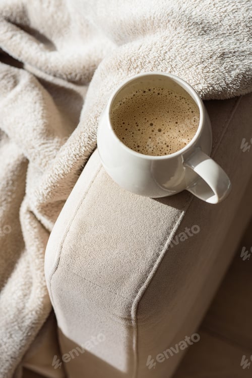 Preview: Cozy Sofa with Blanket and Coffee Mug. Relaxed Home Atmosphere