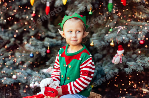 Preview: Christmas in july. Child waiting for Christmas in wood in july