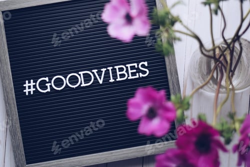 Preview: Hashtag GOOD VIBES on a letter board with a bouquet of pink anemone flowers