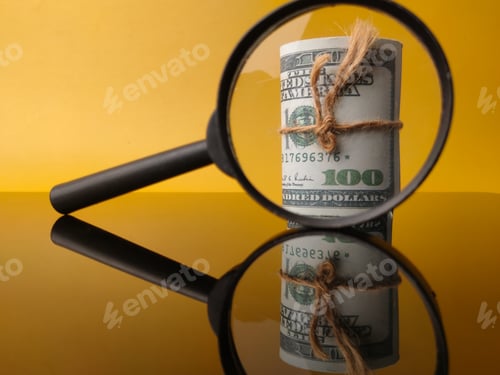 Preview: Banknotes and magnifying glass with reflection on a yellow background