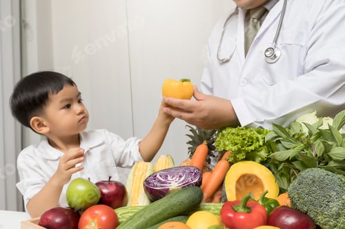 Preview: Child with Doctor and Fresh Vegetables and Fruit